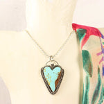Necklace with a heart-shaped turquoise pendant