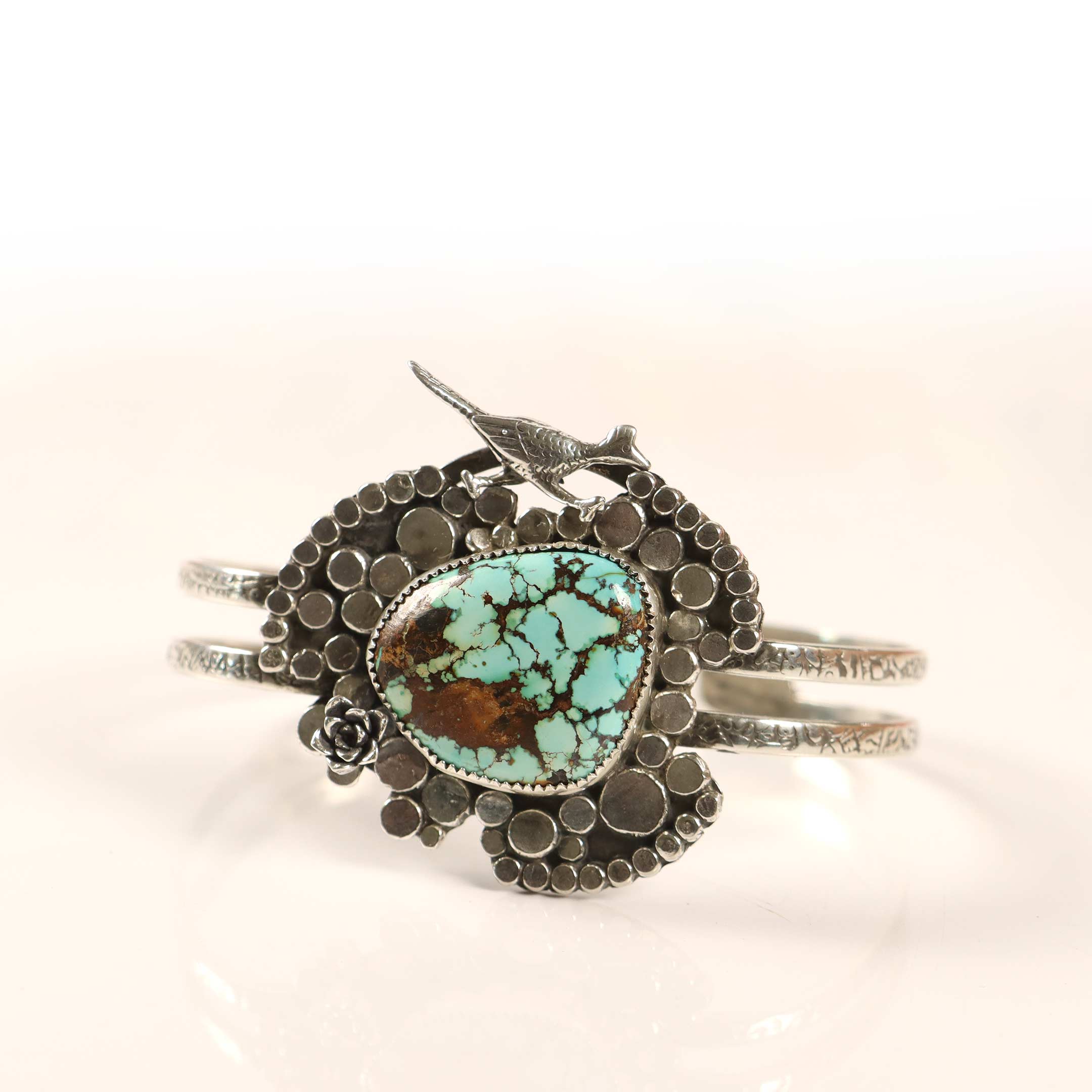 Silver bracelet with a turquoise stone