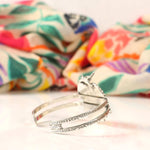 Silver cuff bracelet with intricate designs