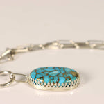 turquoise  with bronze webbing pendant